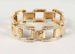 AN IMPRESSIVE YELLOW GOLD DIAMOND SET LINKED BRACELET IN THE CARTIER STYLE, approx 100 diamonds.