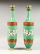 A TALL PAIR OF CONTINENTAL VASES decorated with a horse and chariot (Possibly Minton). 19ins high.