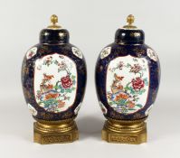 A SUPER LARGE PAIR OF SAMSON OF PARIS FAMILLE ROSE VASES AND COVERS, rich blue ground with famille