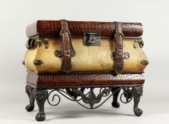 A DECORATIVE STORAGE BOX, modelled as a suitcase on stand. 18ins wide x 14.5ins high.