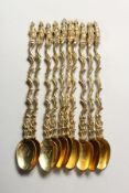 A SET OF TEN SILVER GILT APOSTLE SPOONS.