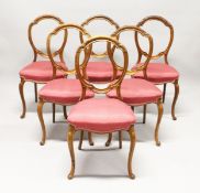 A GOOD SET OF SIX VICTORIAN CABRIOLE LEG DINING CHAIRS with padded seats.