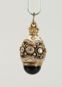 A RUSSIAN SILVER AND ENAMEL EGG PENDANTS.