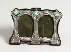 A SMALL DOUBLE SILVER AND ENAMEL PHOTOGRAPH FRAME. 2.5ins x 4ins.