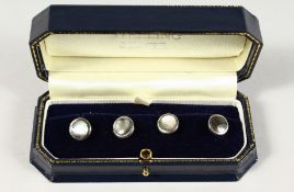 FOUR SILVER AND MOTHER-OF-PEARL STUDS.