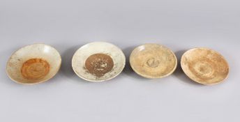 A LOT OF FOUR EARLY CHINESE POTTERY BOWLS, some glazed some unglazed. largest: 15cm diameter.