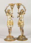 A PAIR OF SPELTER FIGURAL CANDLESTICKS, 20TH CENTURY, modelled as an Egyptian man and woman