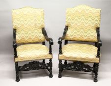 A MATCHED PAIR OF CARVED AND EBONISED JACOBEAN REVIVAL ARMCHAIRS, with upholstered backs and seats.