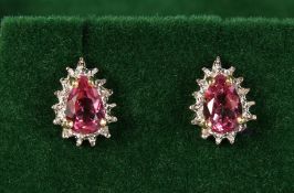 A PAIR OF 9CT GOLD, PEAR SHAPE TOPAZ AND DIAMOND EARRINGS.