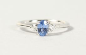 AN 18CT WHITE GOLD THREE STONE SAPPHIRE AND DIAMOND RING, 60 points.