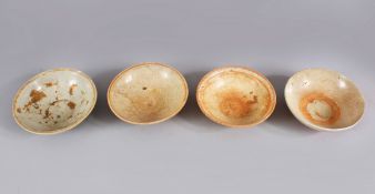 A LOT OF FOUR EARLY CHINESE POTTERY BOWLS, some glazed some unglazed. largest: 15.5cm diameter.