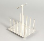 A CHRISTOPHER DRESSER DESIGN FOUR-DIVISION TOAST RACK.
