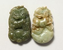 TWO CARVED CHINESE JADE PENDANTS.