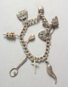 A GOOD SILVER CHARM BRACELET.