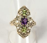 A SUPERB 9CT GOLD, PERIDOT, AMETHYST AND PEARL SUFFRAGETTE RING.