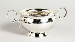 A CASED CIRCULAR TWO-HANDLED BOWL. 3.5ins diameter. Birmingham 1935.