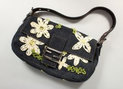A FENDI FLORAL DENIM BAG in a Fendi bag.