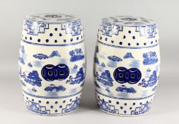 A GOOD PAIR OF CHINESE BLUE AND WHITE BARREL SEATS. 18ins high.