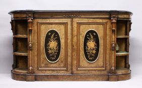 A GOOD VICTORIAN FIGURED WALNUT CREDENZA, with black marble top, the front fitted with a pair of