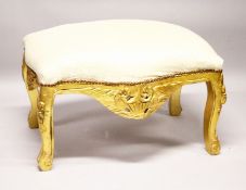 A GILTWOOD WINDOW SEAT with padded top.