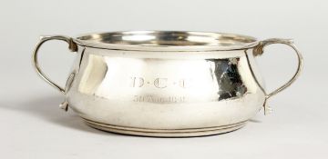 A MAPPIN & WEBB CIRCULAR SILVER TWO-HANDLED BOWL. 3.5ins diameter. Birmingham 1938.