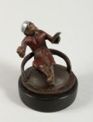 A COLD CAST BRONZE CIRCULAR MONKEY.