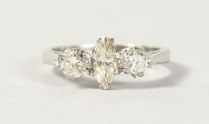 AN 18CT WHITE GOLD THREE STONE DIAMOND RING, the central marquise stone flanked by two brilliant