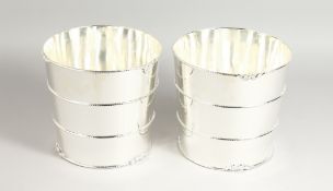 A GOOD PAIR OF PLATED BARREL WINE COOLERS. 7.5ins high.