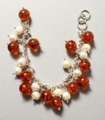 A SILVER, PEARL AND AMBER BRACELET.