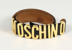 A MOSCHINO ITALIAN BLACK LEATHER AND GILT BELT. 33ins long.