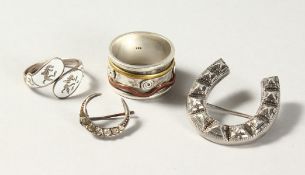 TWO BROOCHES, horseshoe and crescent moon; together with two rings.
