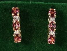 A PAIR OF 9CT GOLD, TOPAZ AND DIAMOND LINE EARRINGS.