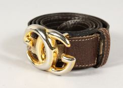 A BROWN LEATHER AND FABRIC GUCCI BELT with GG buckle.