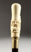 A CARVED BONE HANDLED WALKING STICK, CHINESE HEAD.