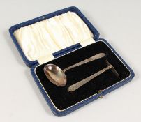 A BABIES SILVER PUSHER AND SPOON.