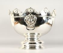 A GOOD LARGE CIRCULAR MONTEITH BOWL with lion ring handles, on circular base. 18ins diameter x 15ins