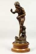 GREGORE A GOOD 19TH CENTURY BRONZE of a young man, standing by a tree stump, a birds nest in his