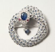 A SILVER SAPPHIRE SET PANTHER SNAKE BROOCH.