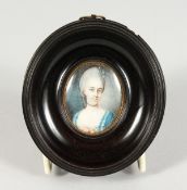 AN 18TH/19TH CENTURY OVAL PORTRAIT MINIATURE, bust length of a lady wearing a blue dress, in an