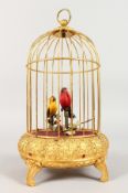 AN AUTOMATON BIRD IN A CAGE. 10ins high.