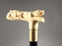 A CARVED BONE HANDLED WALKING STICK, DOG.