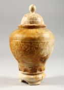 AN ALBASTER JAR AND COVER, of baluster form, relief carved with a grape and vine decoration. 8.75ins
