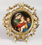 A GOOD DRESDEN CIRCULAR PLAQUE, Mother and two children 5.5ins diameter, in an Italian gilt frame.