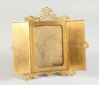 A FOLDING GILT BRONZE PHOTOGRAPH FRAME.