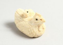 A SMALL CARVED BONE CHICKEN NETSUKE.