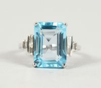 A GOOD 18CT WHITE GOLD, BLUE TOPAZ (10.5CTS) AND DIAMOND RING.