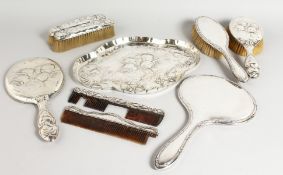 A SILVER SIX-PIECE DRESSING TABLE SET, comprising tray, hand mirror, hand brush, pair brushes and