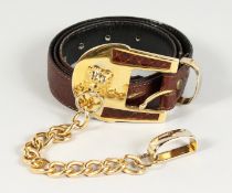 A BROWN LEATHER AND GILT BELT. 35ins long.