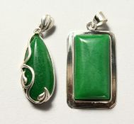 TWO SILVER AND JADE PENDANTS.