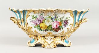 A LARGE LATE 19TH CENTURY CONTINENTAL OVAL BASKET, edged in gilt and painted with flowers. 18ins